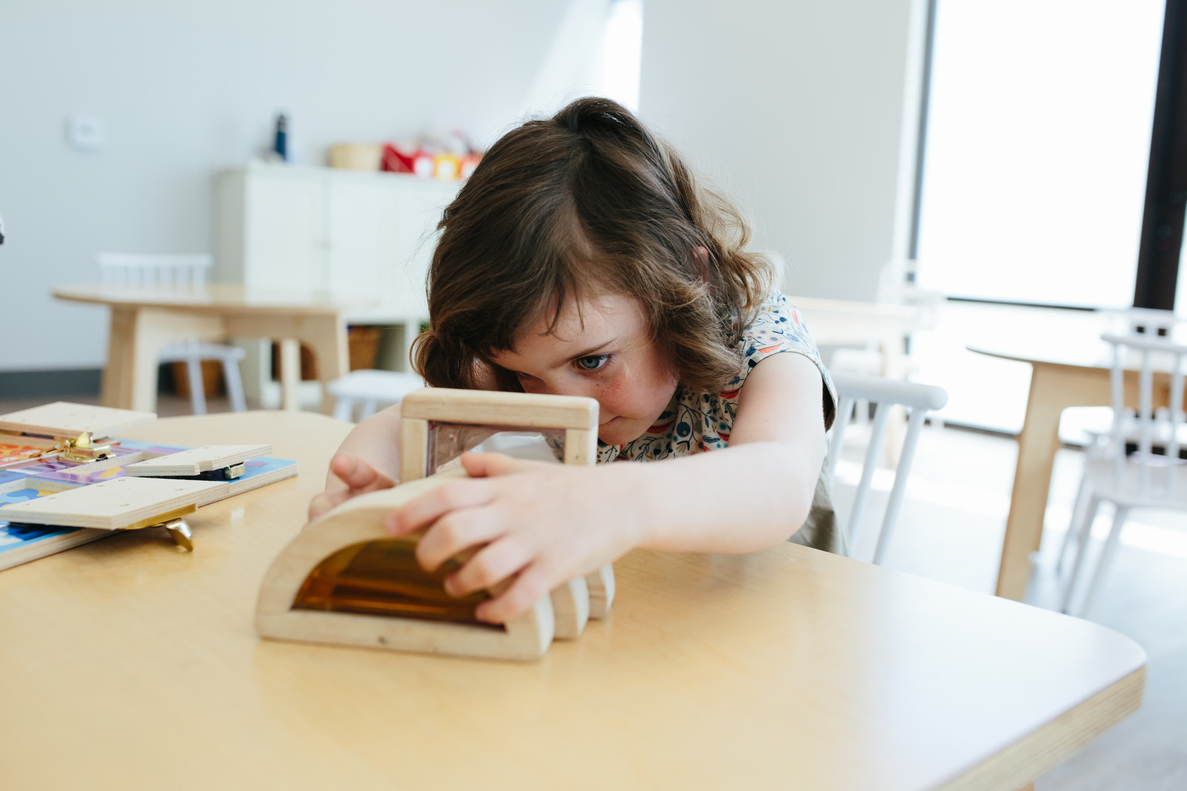 Child playing with blocks on a table