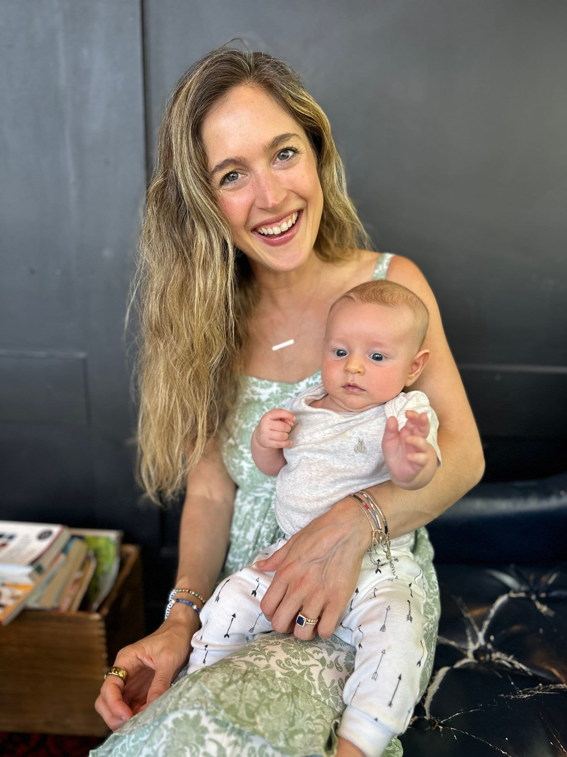 West Los Angeles Director Erica Baron holding an infant